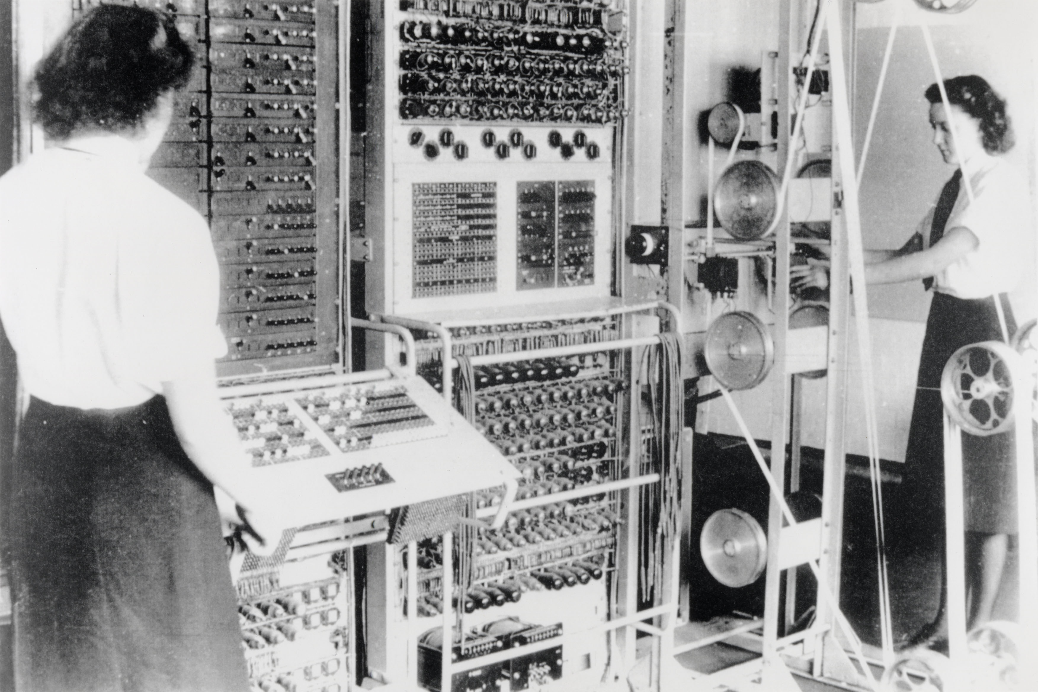 Old photo of 2 women in front of a computer